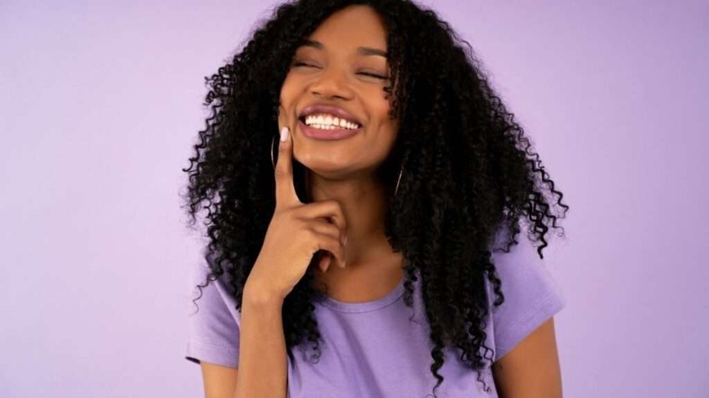 Woman thinking happily about her contraception pill options