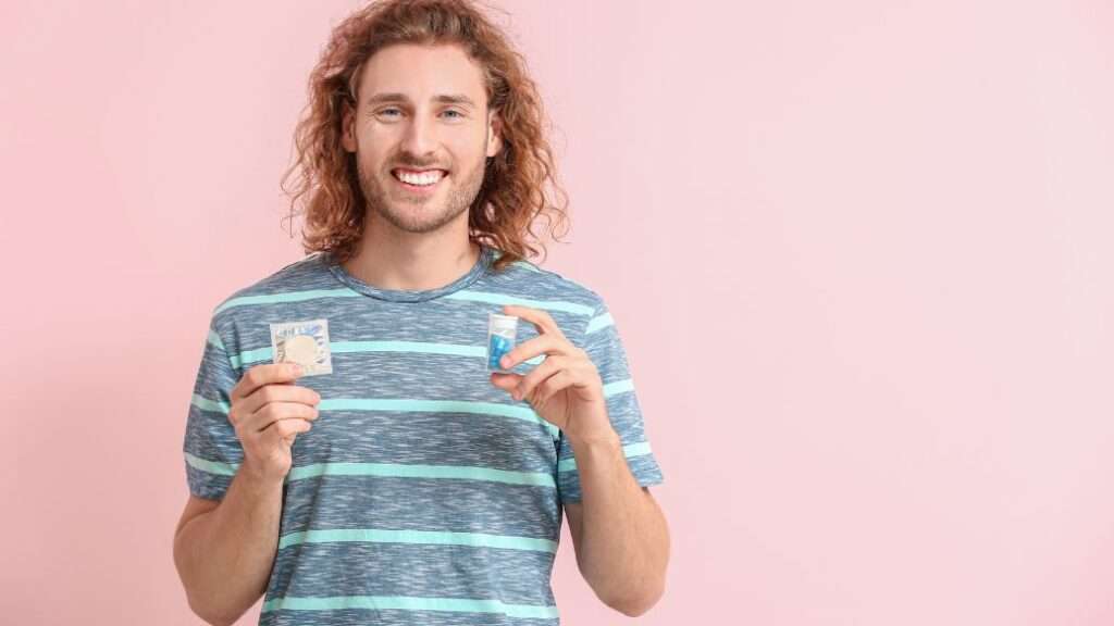 Happy man holding erectile dysfunction treatment options