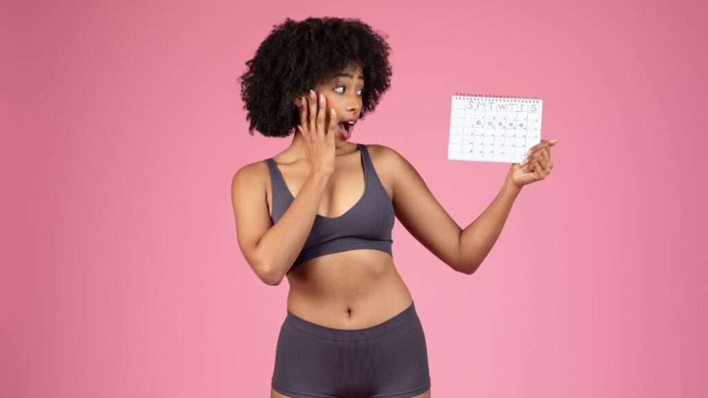 Woman with a calendar considering period delay treatments