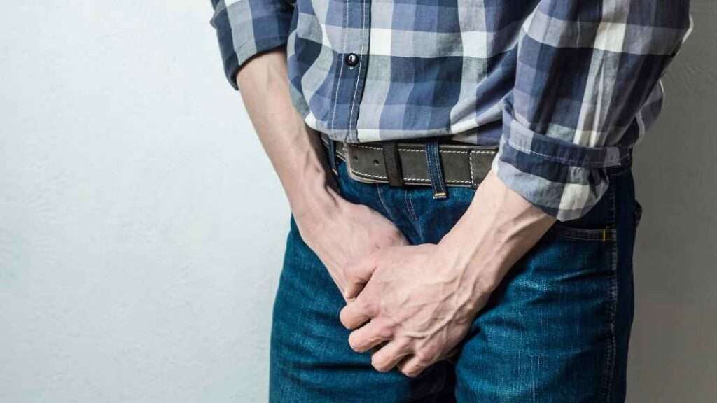 Man covering his crotch who needs premature ejaculation treatment