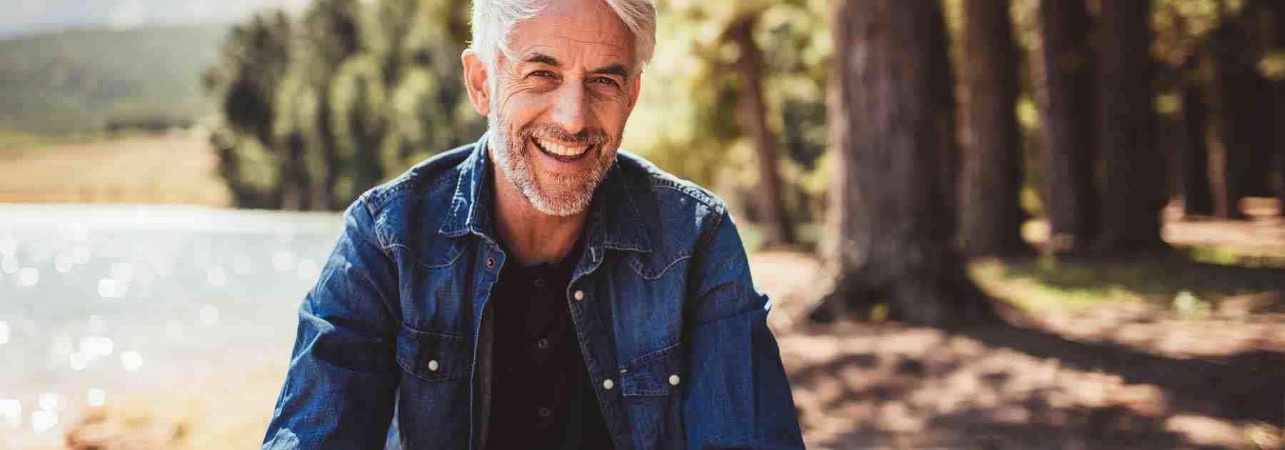 Happy man outdoors who has combatted erectile dysfunction