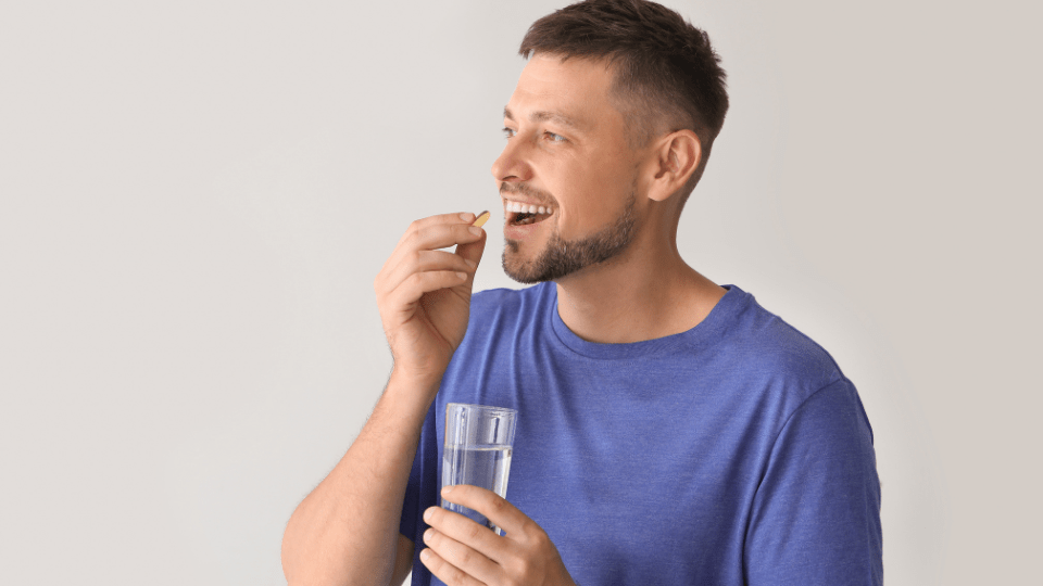 man taking pill