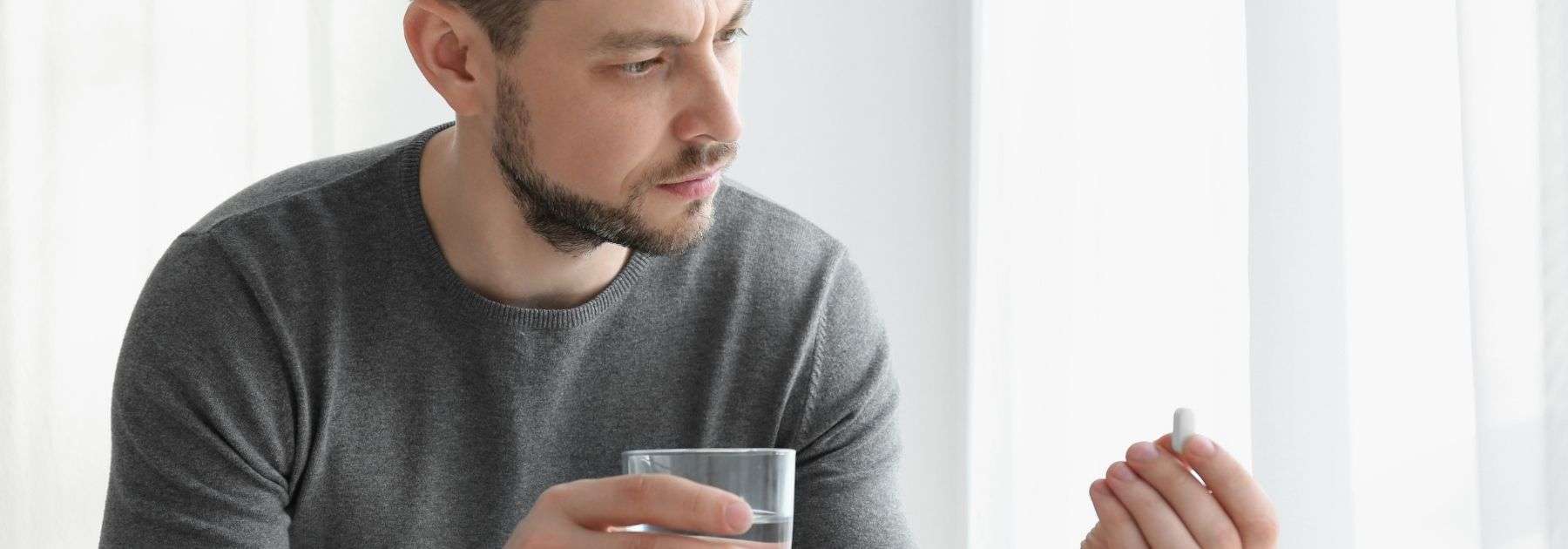 man taking pill