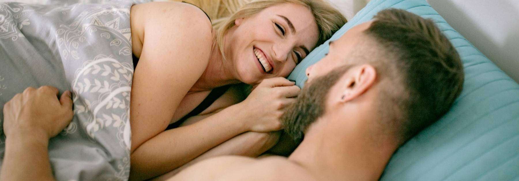 man woman in bed